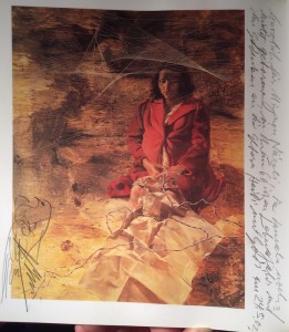 The image shows a printed reproduction of the painting with a hand-written dedication by Hans Erni to Mignon Naegeli.